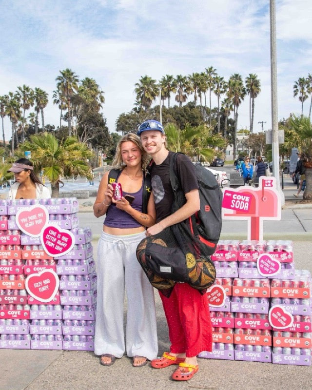 A couple at a Cove beach pop-up