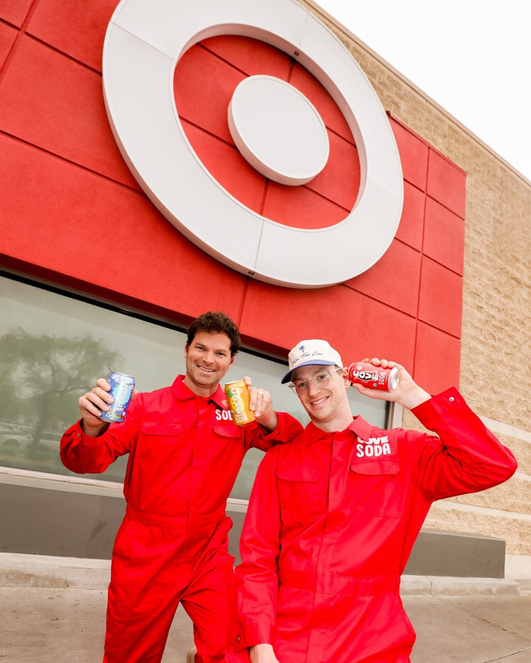 The founders toasting cans beneath a giant Target bullseye