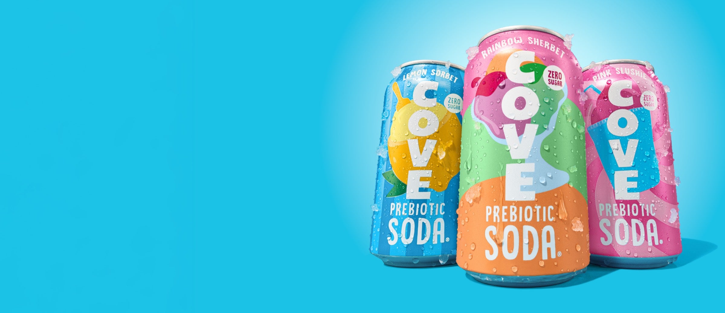 Three frost-covered cans of Cove prebiotic soda — Lemon Sorbet, Rainbow Sherbet, and Pink Slushie