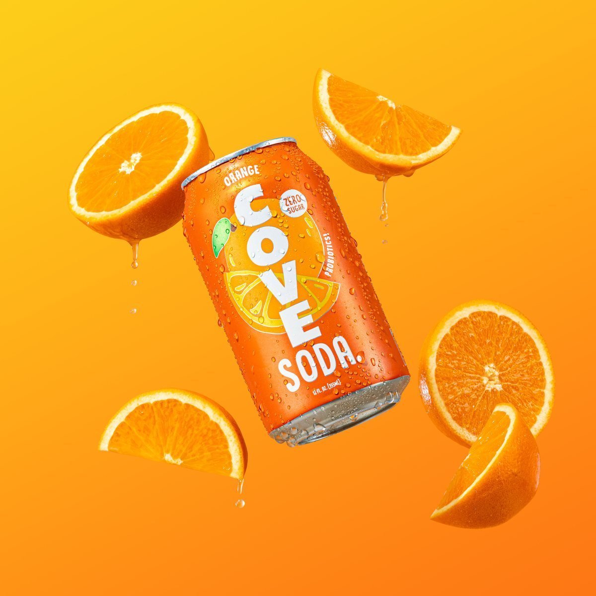 A Cove Orange can with floating orange slices on an orange backdrop